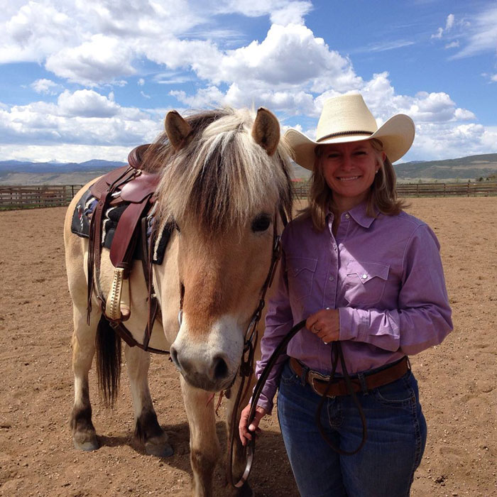 Freddie the Norwegian Fjord Horse and Christine Hamilton, Western Horseman editor, at a clinic with Buster and Sheryl McLaury.