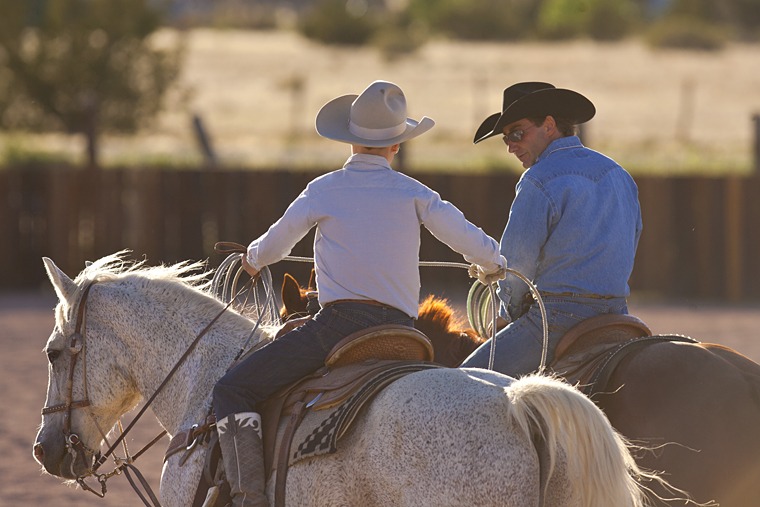 Mortenson and his son, Wyatt, work together on their team roping skills.