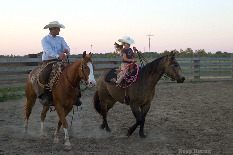 Paxton Ramsey and his daughter, Haidyn, ride together at dusk on the Seven L Ranch on the Texas Gulf Coast. The Ramsey family has ranched in the area since 1904 and today raises commercial cattle and registered Quarter Horses.