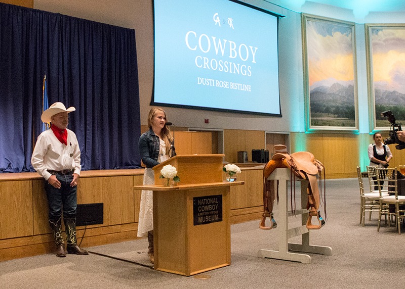 Dusti Rose Bistline receives a scholarship at the 2018 Cowboy Crossings