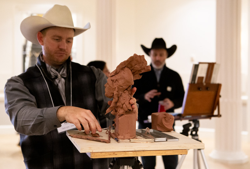 Cowboy Artists Dustin Payne and Teal Blake give a demonstration.