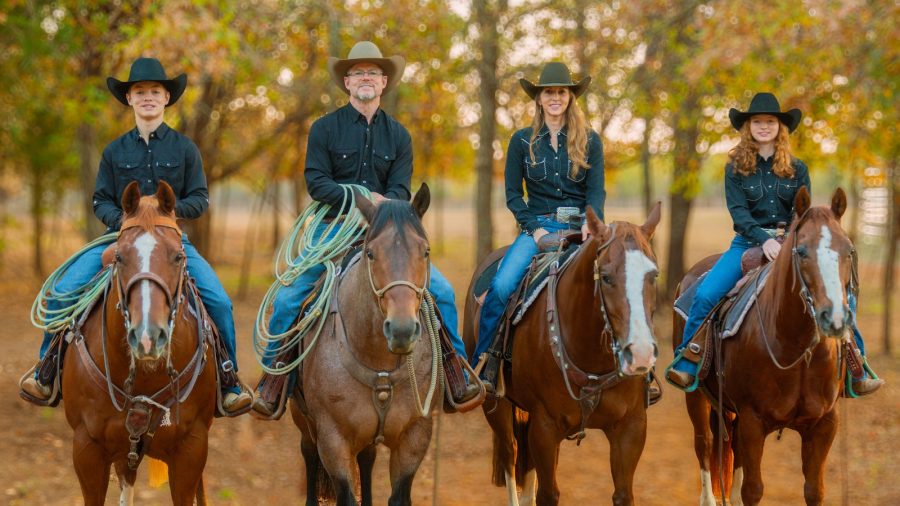 The Cox family rides their horses.