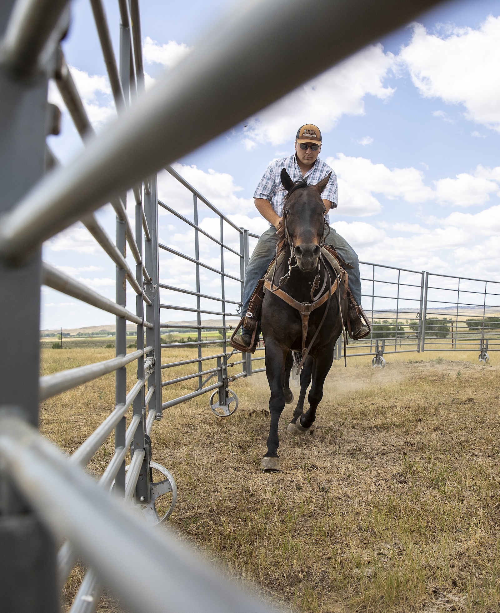 Holden rides his horse through the All-Purpose Corral set as a round pen, using the space for groundwork and training.