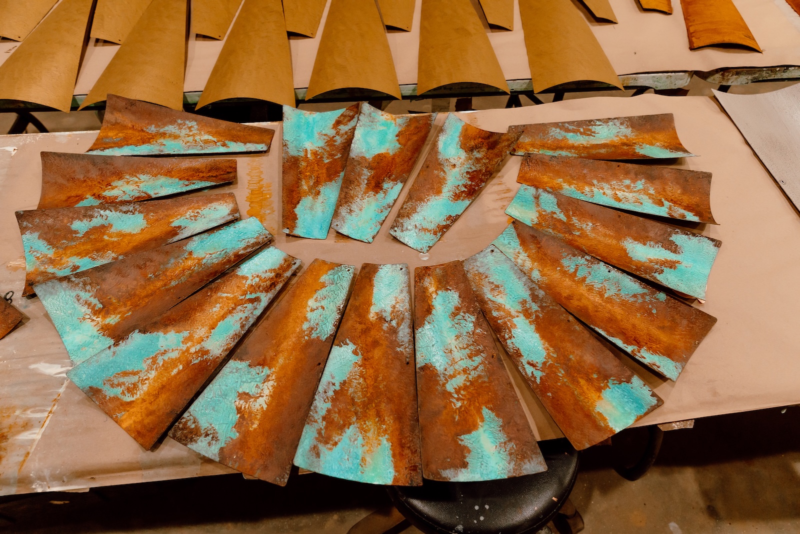 Artisans prepare Royston Turquoise blades, each fan is painted by hand and tested.