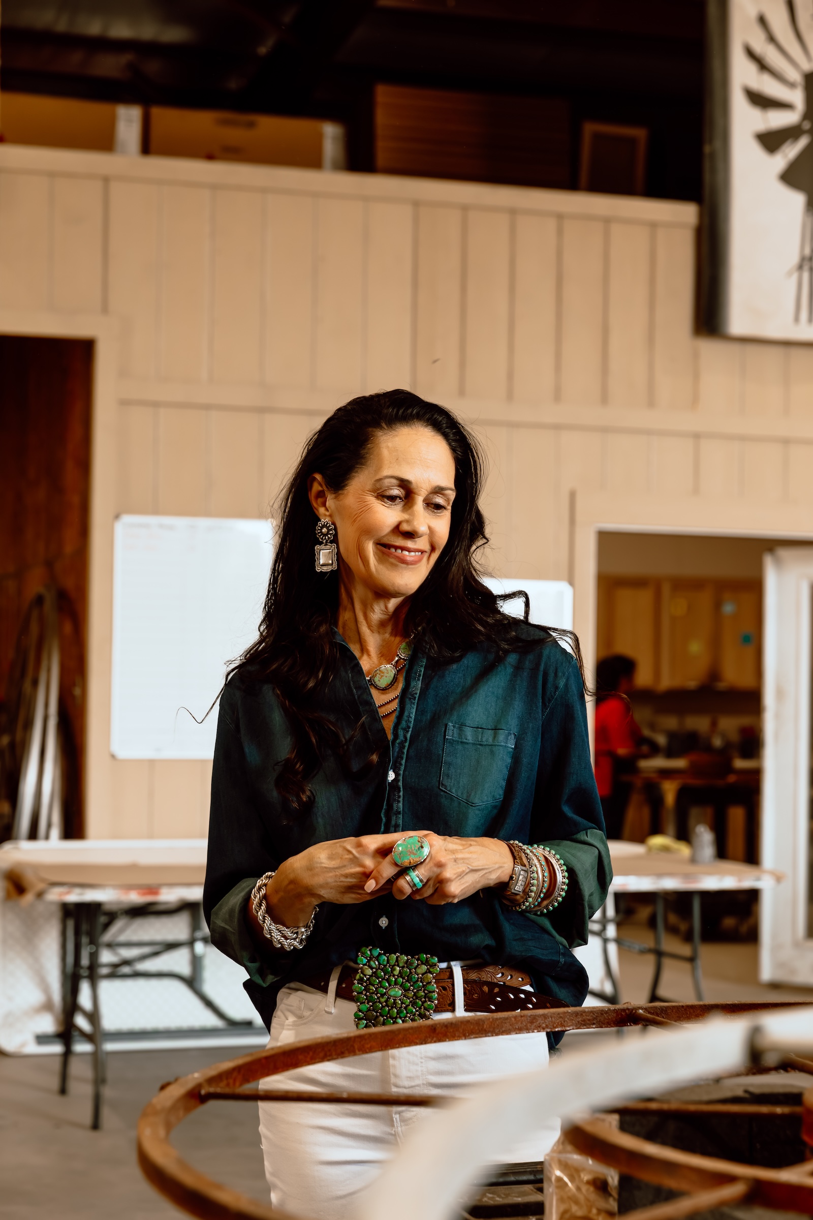Founder Kelly Eggers looks at a custom fan in process inside their Pilot Point, Texas, production facility.