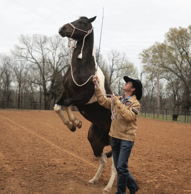 Harrison demonstrates a trick with Gus, the 27-year-old Paint gelding he's had for the better part of his career. 