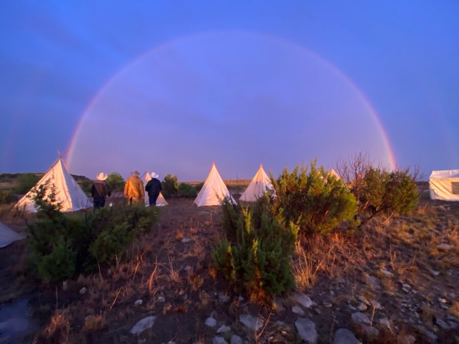 Rainbow over tents
