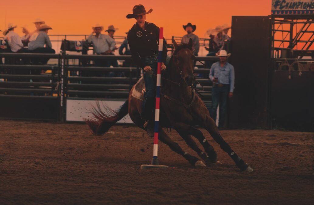 Rodeo competitor leans into a fast turn around the pole. Photo courtesy of Sandhills Event Center.