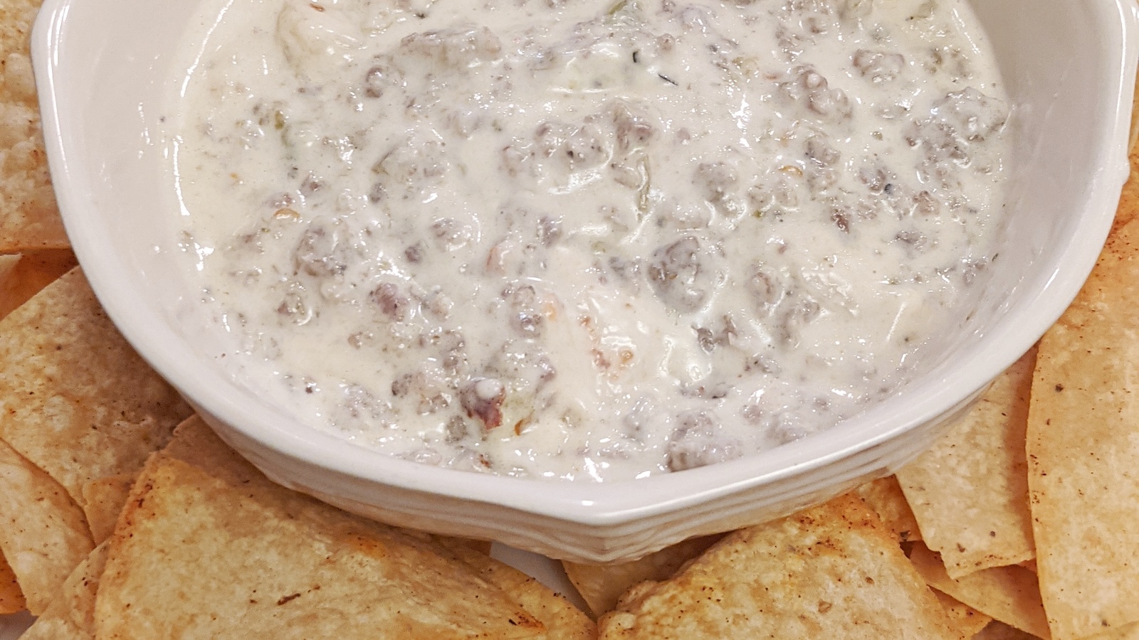 Gary’s Green Chile Queso Blanco served with tortilla chips.