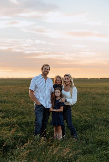 The Vander Dussen family out on the family farm pose for a picture just as the sun sets. From left to right: Daniel, Anneliese, Tara and Gwenevere in front.