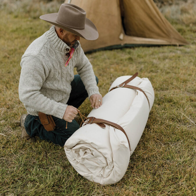 Cowboy with a J.M. Capriola Co. bedroll. 